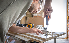 screwing-self-tapping-screw-into-metal-fastening-hole-wood-strip-using-screwdriver-work-carpenter 2 (2)